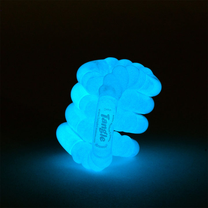 Sensory Twisty tactile fight toy tangle glow in the dark, glowing blue on a black background