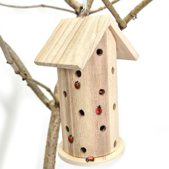 wooden hand crafting ladybird house from forest school urban schools kit