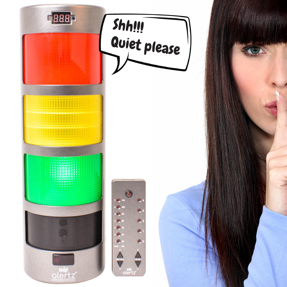 An electronic device displaying the Alertz® logo, designed to reduce noise levels in various settings such as classrooms, halls, dining areas, and libraries. It features a traffic light system indicating noise levels, with green for acceptable, amber for 