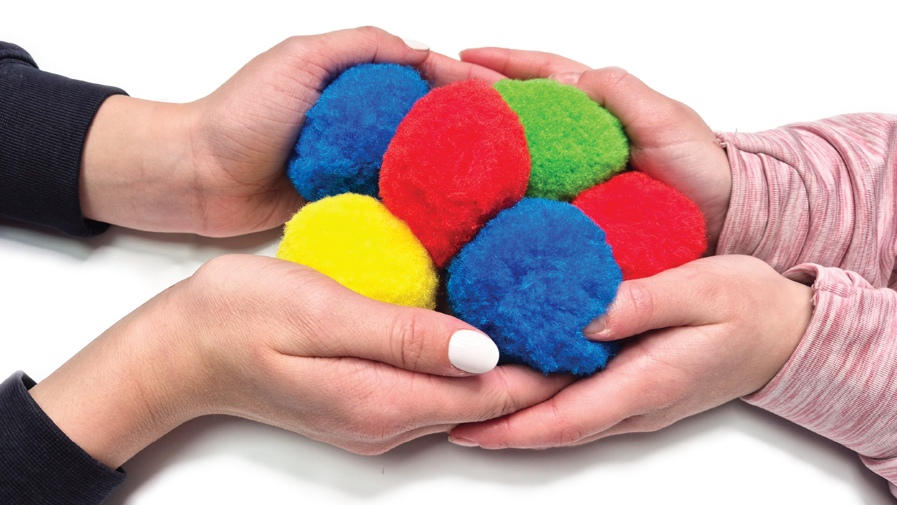 Eduk8 colourful sensory water balls held in children's hands