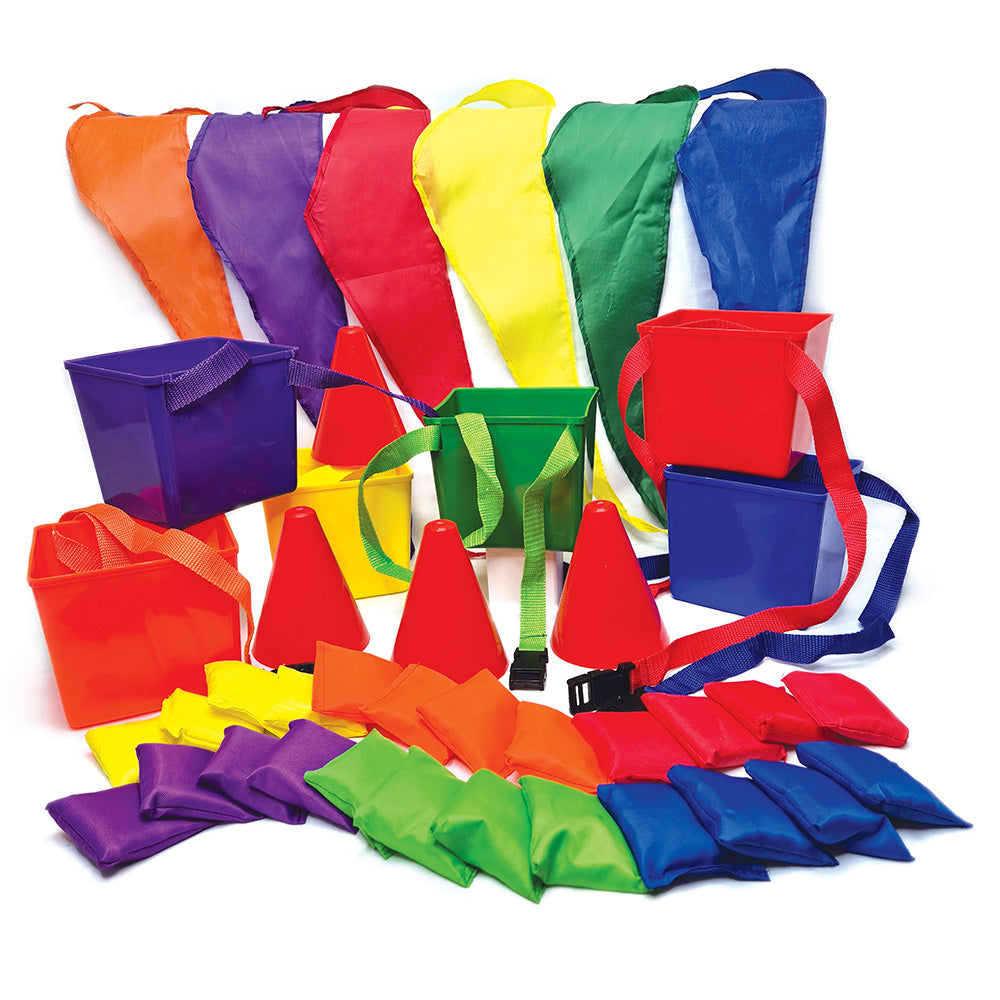 A collection of colorful buckets, bean bags, blindfolds, and boundary cones arranged for group play, presumably part of the 'Bucket Dash' game set.